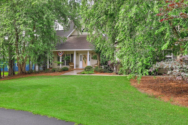 901 Patriots Pt, Mccormick, SC 29835 - view of front of house featuring a front lawn, a shingled roof, and covered porch