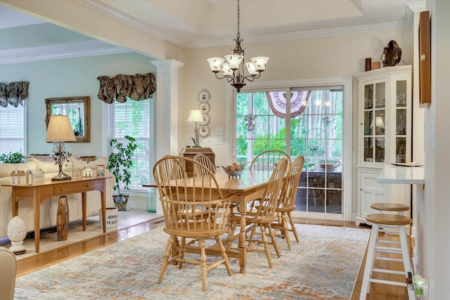 901 Patriots Pt, Mccormick, SC 29835 - dining space featuring a chandelier, plenty of natural light, wood finished floors, and crown molding
