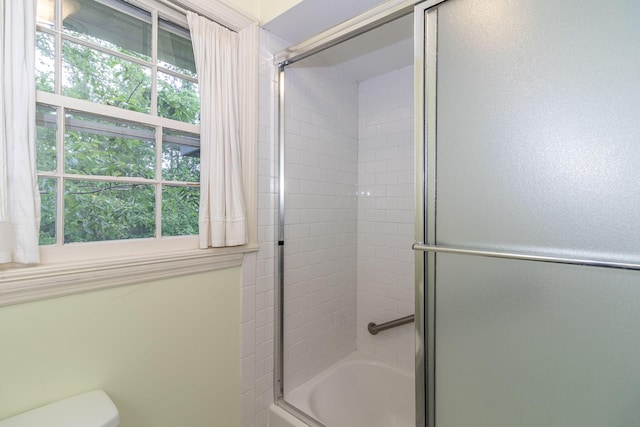 3247 Ramsgate Rd, Augusta, GA 30909 - bathroom featuring plenty of natural light, shower / bath combination with glass door, and toilet
