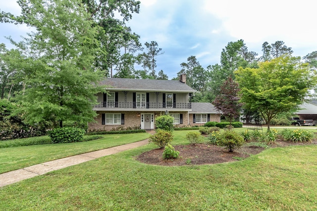 3247 Ramsgate Rd, Augusta, GA 30909 - view of front of property with a front lawn, a chimney, and brick siding