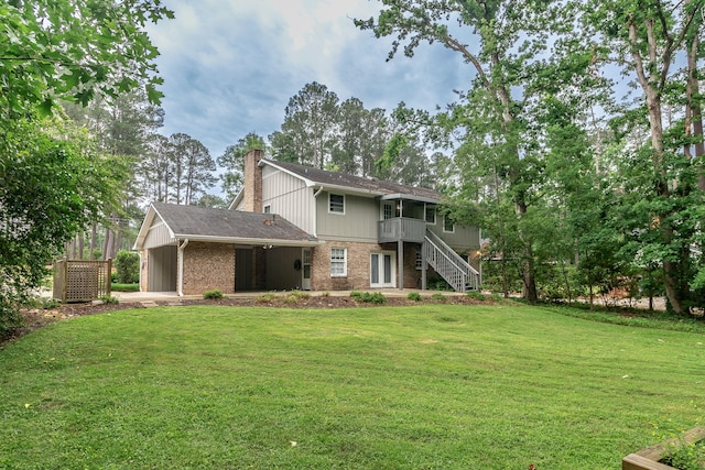 3247 Ramsgate Rd, Augusta, GA 30909 - back of property featuring a chimney, a yard, brick siding, and stairs