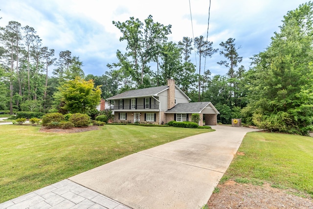3247 Ramsgate Rd, Augusta, GA 30909 - view of front facade featuring a chimney, a balcony, driveway, a front yard, and brick siding