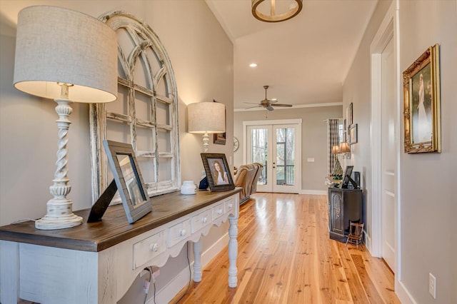 hall featuring french doors and light hardwood / wood-style flooring