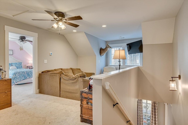 carpeted living room with vaulted ceiling