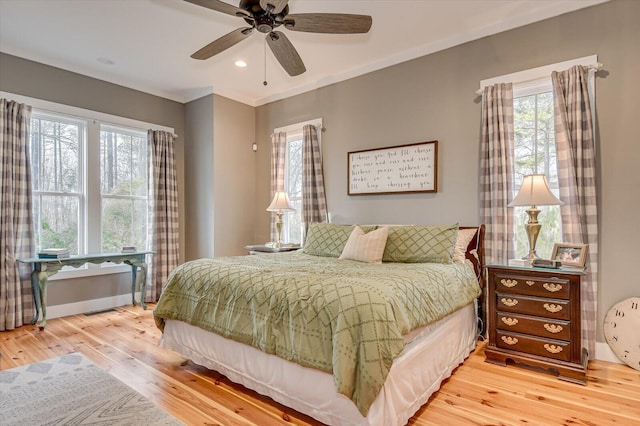 bedroom with ceiling fan and hardwood / wood-style floors