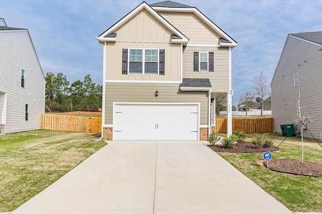 craftsman house with a garage and a front yard