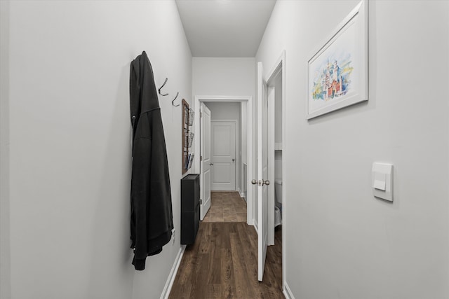 corridor featuring dark hardwood / wood-style flooring