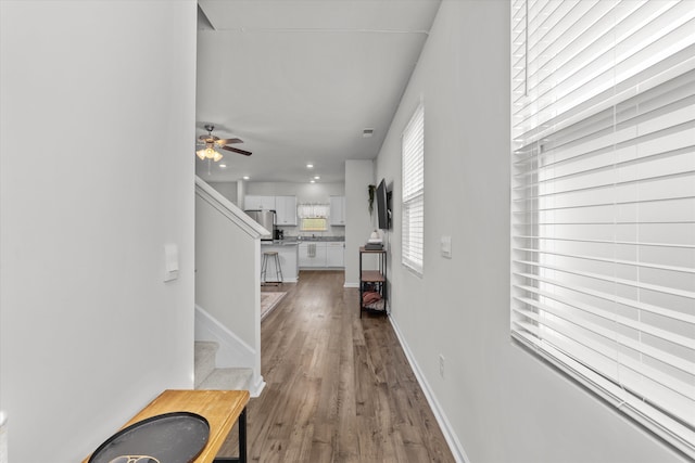 corridor featuring hardwood / wood-style flooring