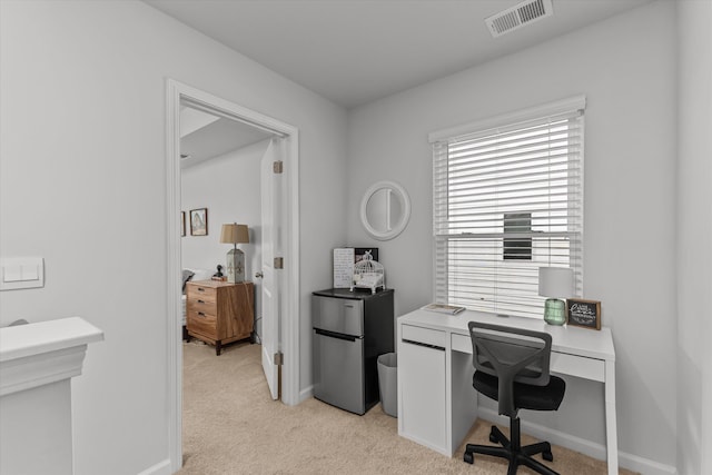 office area with light colored carpet