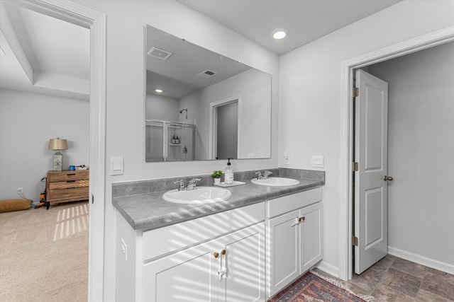 bathroom with vanity and an enclosed shower