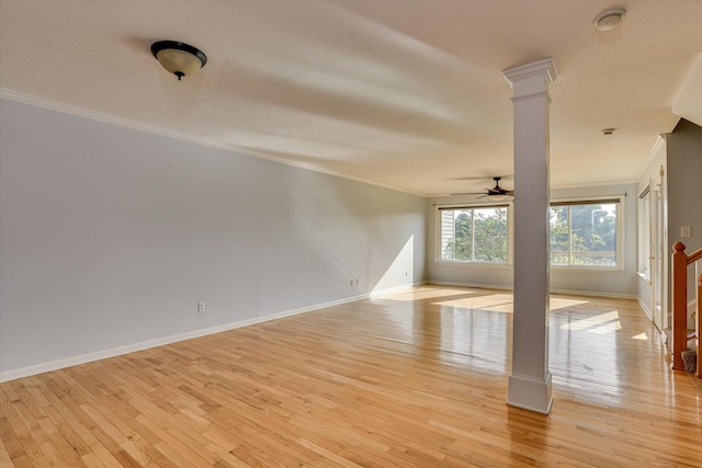 690 Riverfront Dr, Augusta, GA 30901 - spare room with crown molding, ceiling fan, decorative columns, and light wood-style flooring