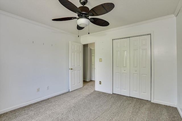 690 Riverfront Dr, Augusta, GA 30901 - unfurnished bedroom with crown molding, light colored carpet, a ceiling fan, baseboards, and a closet