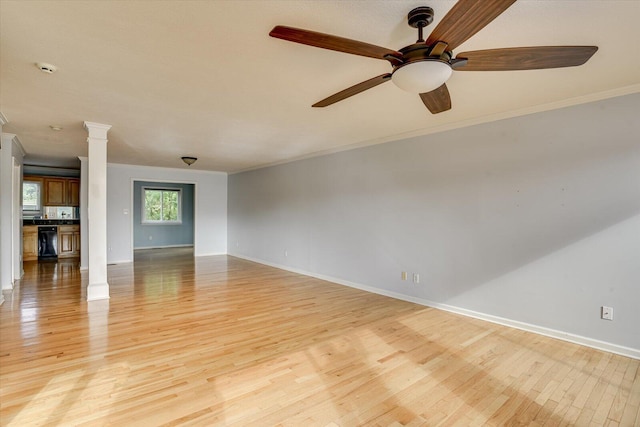 690 Riverfront Dr, Augusta, GA 30901 - unfurnished living room featuring baseboards, decorative columns, ornamental molding, and light wood-style floors