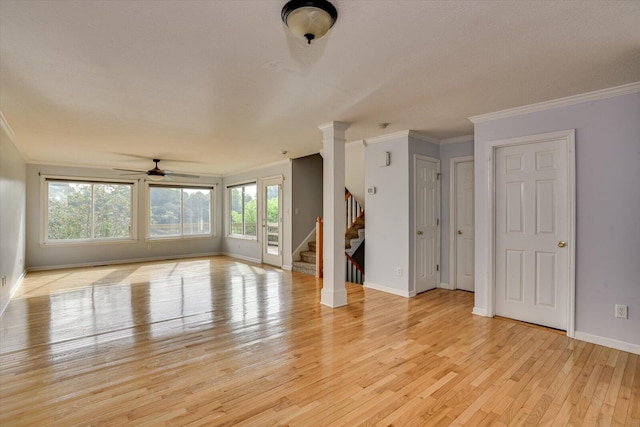 690 Riverfront Dr, Augusta, GA 30901 - unfurnished living room with ornamental molding, a ceiling fan, stairs, and light wood-style flooring