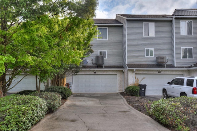 690 Riverfront Dr, Augusta, GA 30901 - rear view of house featuring driveway, central AC unit, and a garage