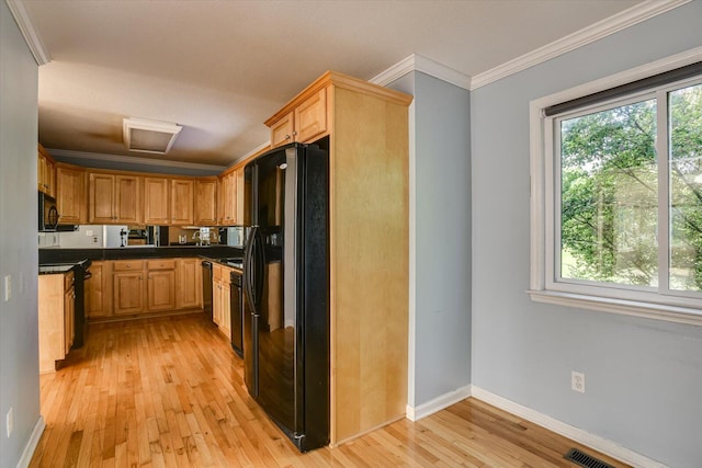 690 Riverfront Dr, Augusta, GA 30901 - kitchen with crown molding, black appliances, light wood-type flooring, and a healthy amount of sunlight