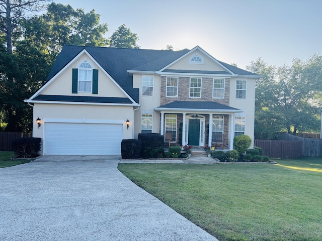 517 Avrett Ct, Evans, GA 30809 - view of front of property with driveway, stone siding, stucco siding, and a garage