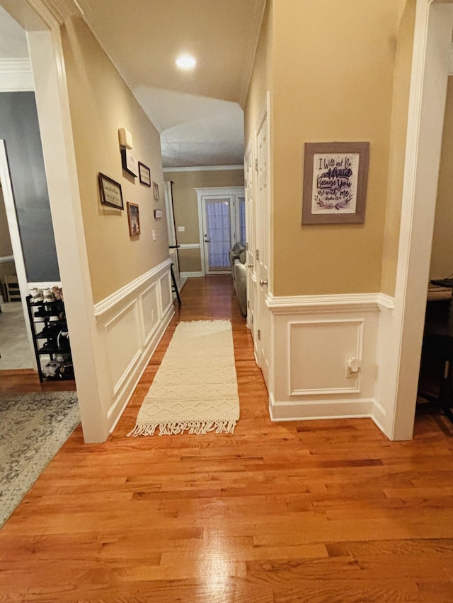 517 Avrett Ct, Evans, GA 30809 - hall with a decorative wall, crown molding, wood finished floors, and wainscoting