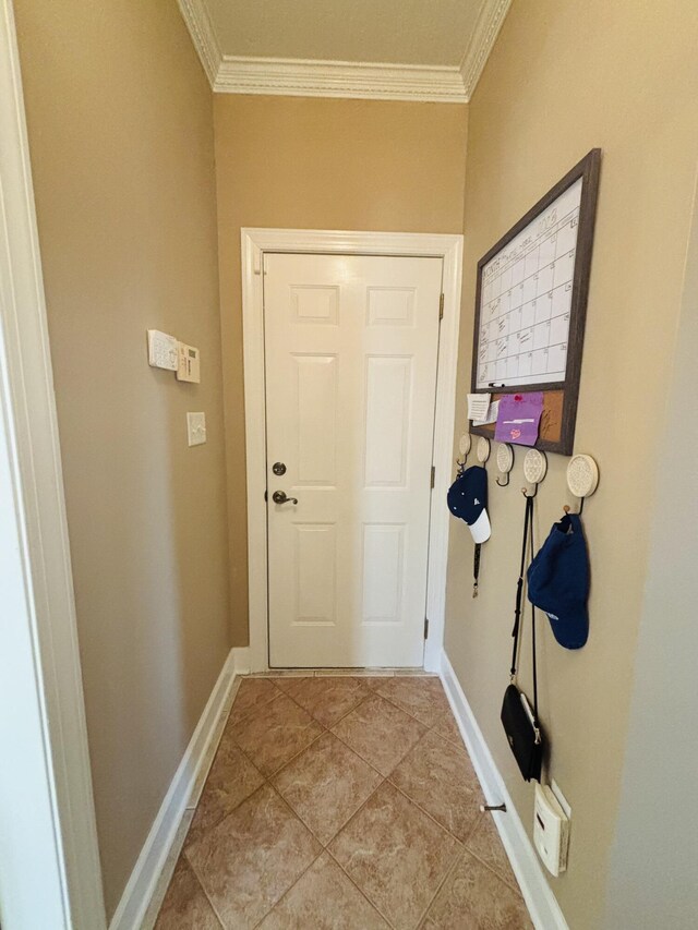 517 Avrett Ct, Evans, GA 30809 - doorway to outside with crown molding, light tile patterned floors, and baseboards
