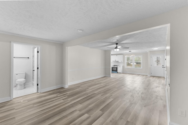 unfurnished living room with light wood-type flooring, a textured ceiling, and ceiling fan