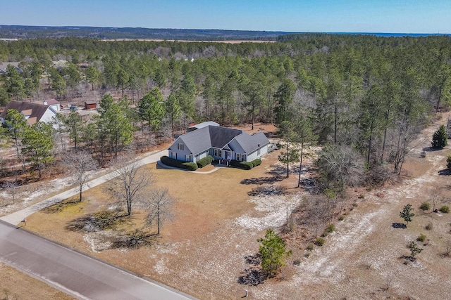 bird's eye view featuring a view of trees