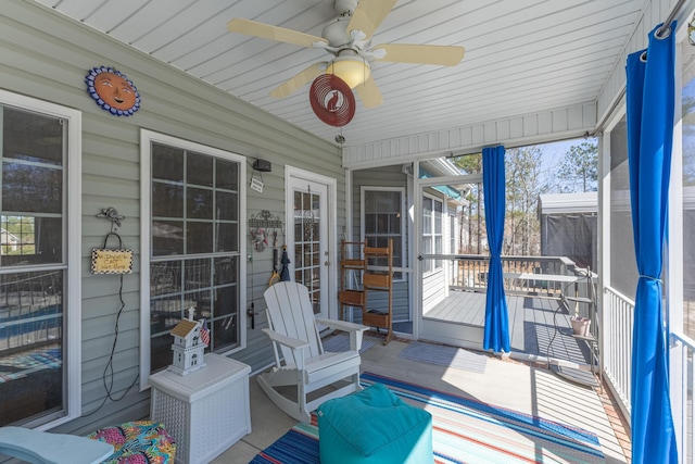 sunroom with a ceiling fan