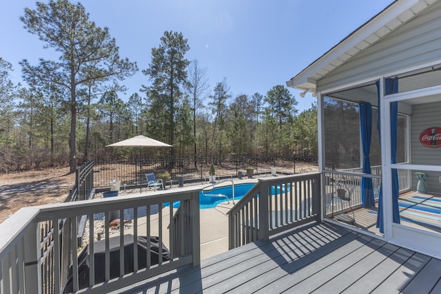 wooden terrace with a patio, a fenced in pool, and fence