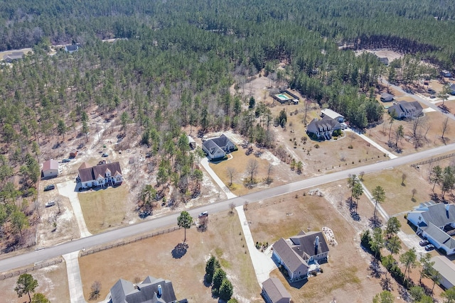 aerial view with a wooded view