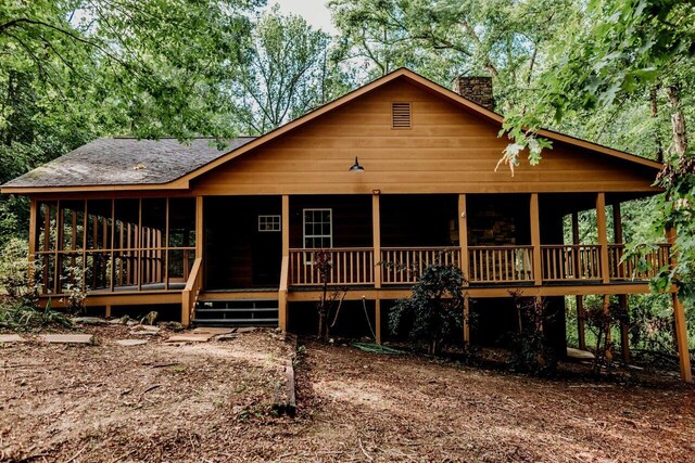 8643 Underwood Rd, Mitchell, GA 30820 - log home featuring a chimney and a shingled roof