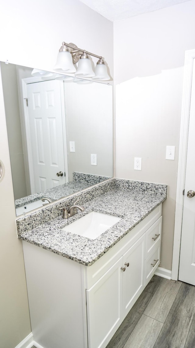 2154 Peppermint Pl, Augusta, GA 30906 - bathroom featuring vanity, baseboards, and wood finished floors