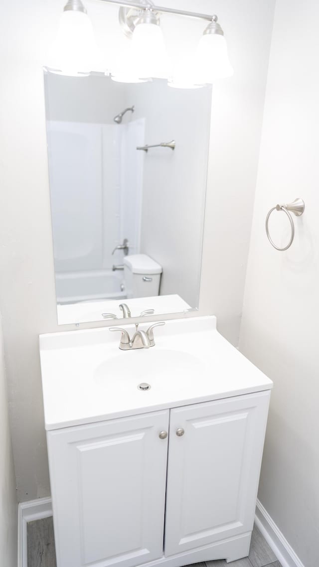 2154 Peppermint Pl, Augusta, GA 30906 - bathroom with baseboards, washtub / shower combination, vanity, and toilet