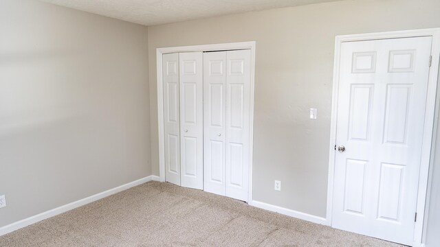 2154 Peppermint Pl, Augusta, GA 30906 - unfurnished bedroom with carpet floors, a closet, and baseboards