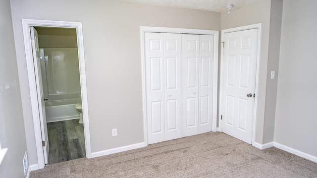 2154 Peppermint Pl, Augusta, GA 30906 - unfurnished bedroom featuring ensuite bath, carpet, baseboards, and a closet