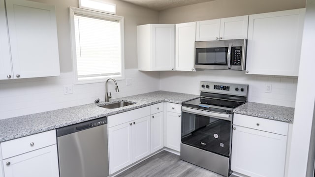 2154 Peppermint Pl, Augusta, GA 30906 - kitchen featuring white cabinetry, appliances with stainless steel finishes, and a sink
