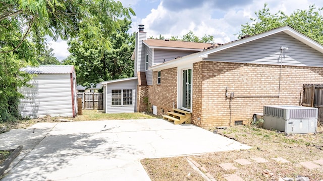 2154 Peppermint Pl, Augusta, GA 30906 - rear view of house with a patio, a chimney, fence, brick siding, and entry steps