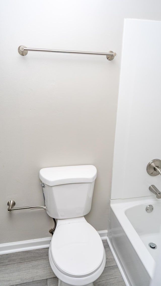 2154 Peppermint Pl, Augusta, GA 30906 - bathroom with baseboards, washtub / shower combination, and toilet