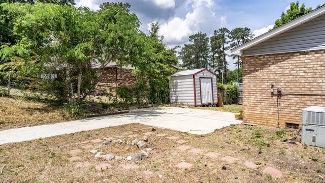 2154 Peppermint Pl, Augusta, GA 30906 - view of yard featuring a patio area, fence, a shed, and an outbuilding