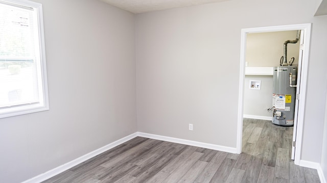 2154 Peppermint Pl, Augusta, GA 30906 - laundry room with water heater, light wood finished floors, hookup for a washing machine, and baseboards