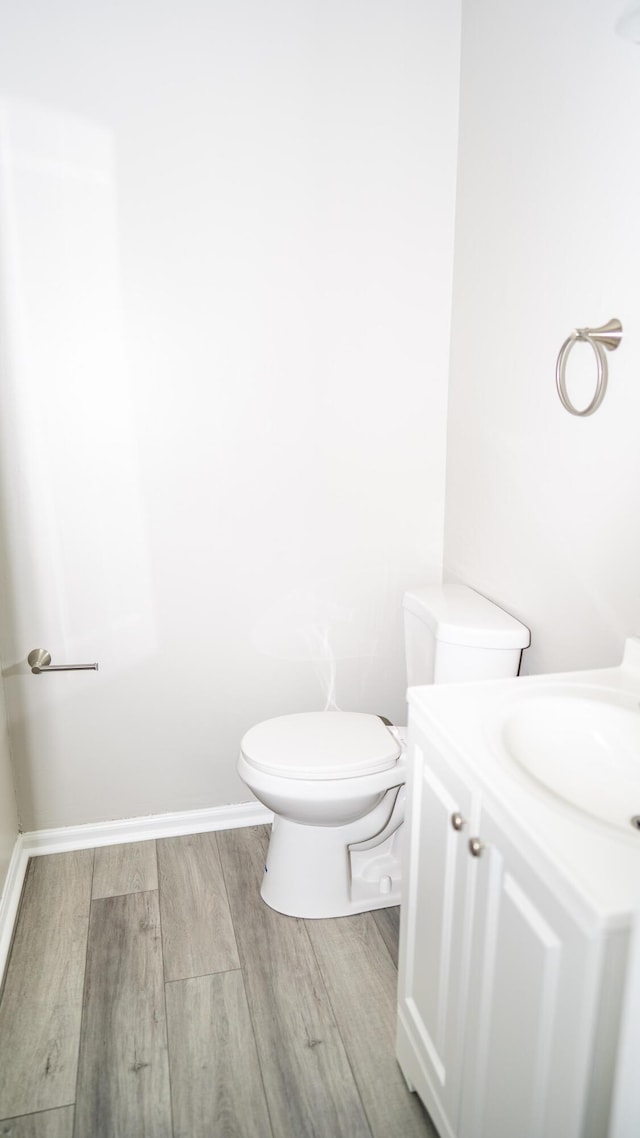 2154 Peppermint Pl, Augusta, GA 30906 - half bathroom featuring toilet, wood finished floors, vanity, and baseboards
