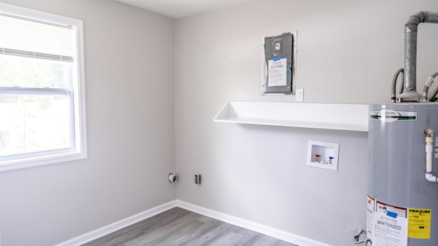 2154 Peppermint Pl, Augusta, GA 30906 - laundry room featuring laundry area, wood finished floors, a healthy amount of sunlight, and water heater
