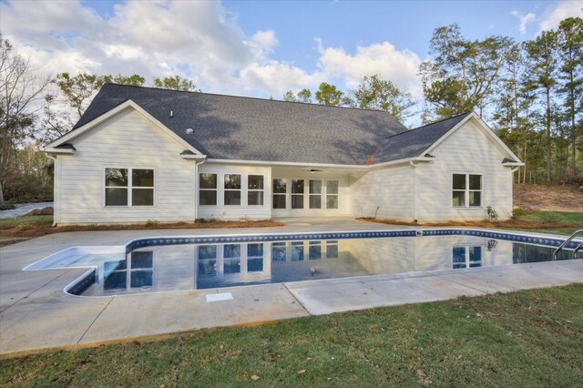 rear view of house with a patio