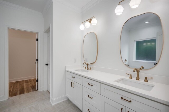 bathroom featuring vanity and crown molding