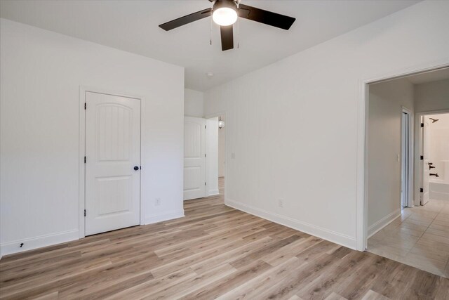 unfurnished bedroom featuring ceiling fan and light wood-type flooring