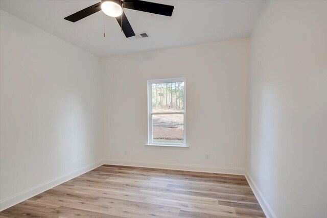 empty room featuring light hardwood / wood-style flooring and ceiling fan