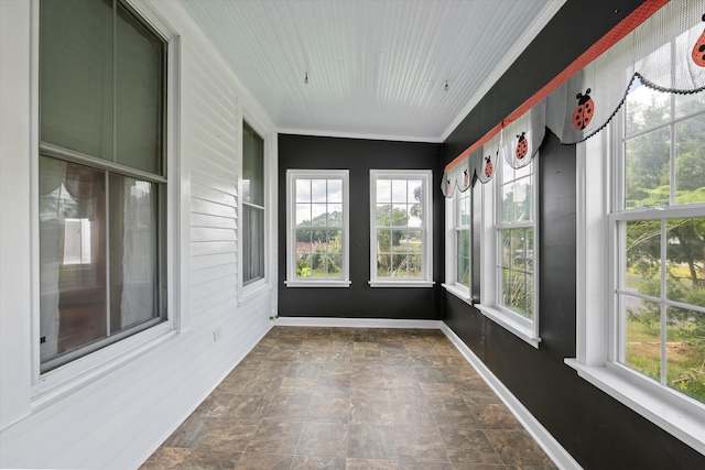 unfurnished sunroom featuring lofted ceiling