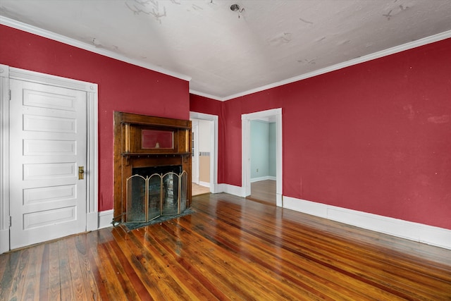 unfurnished living room featuring crown molding and dark hardwood / wood-style flooring