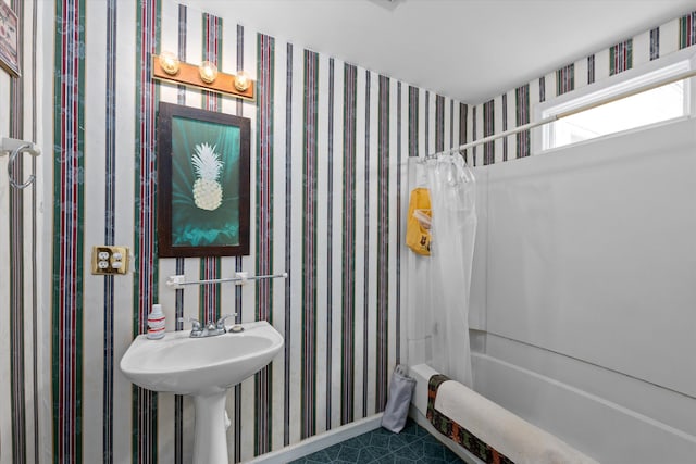 bathroom featuring shower / bathtub combination with curtain