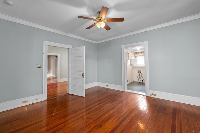 empty room with hardwood / wood-style flooring, ceiling fan, and crown molding