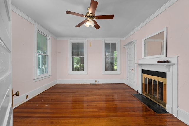 unfurnished living room featuring crown molding, ceiling fan, and dark wood-type flooring