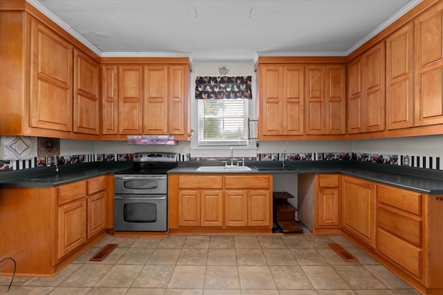 kitchen with light tile patterned floors, electric range, crown molding, and sink